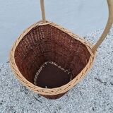 Vintage wicker log basket on vintage wheels