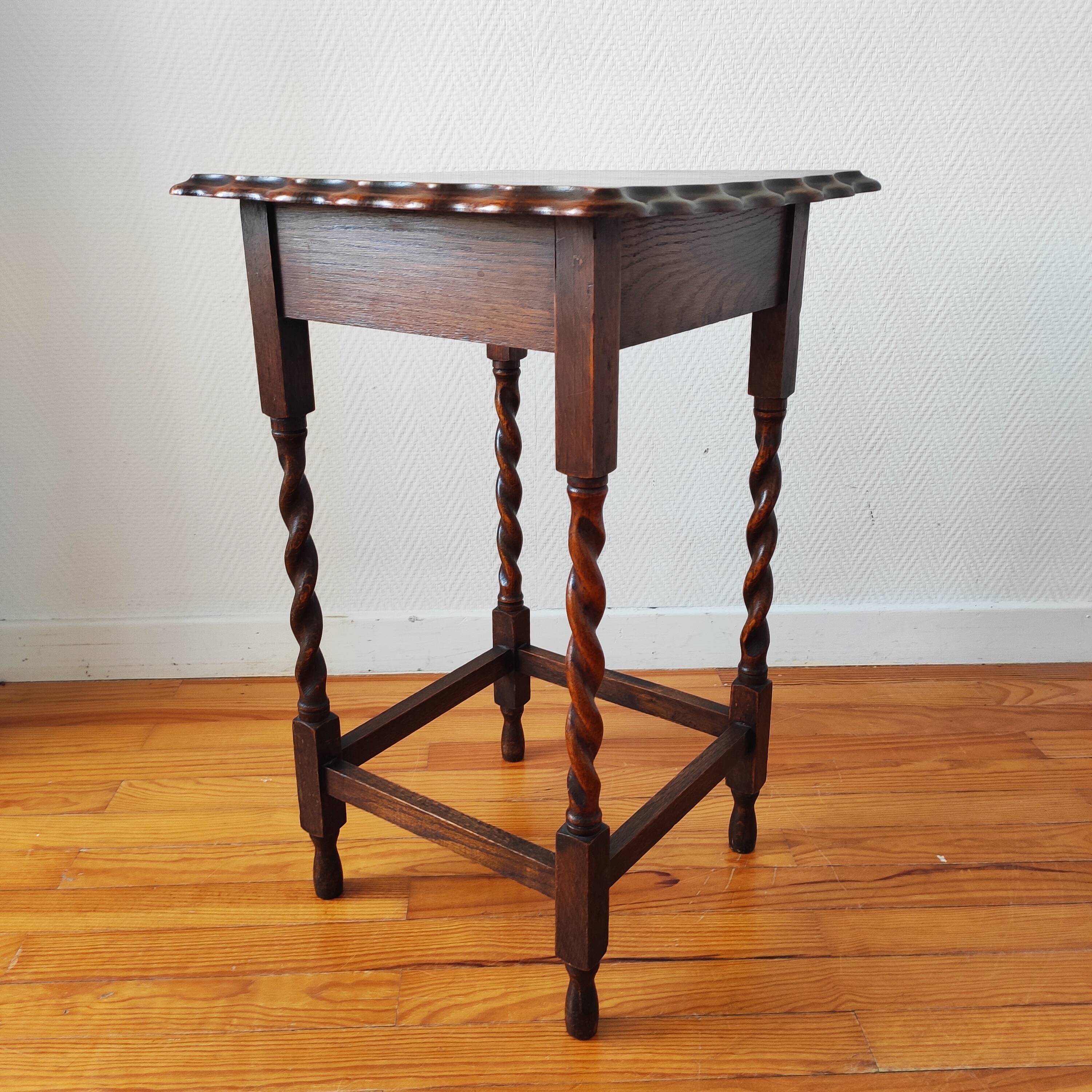 Antique solid oak side table with turned wooden legs.