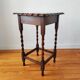 Antique solid oak side table with turned wooden legs.