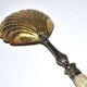 Empire sprinkling spoon in gilded silver vermeil and mother-of-pearl, 19th century.