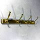 Gold coloured aluminium wall coat rack 1960’s