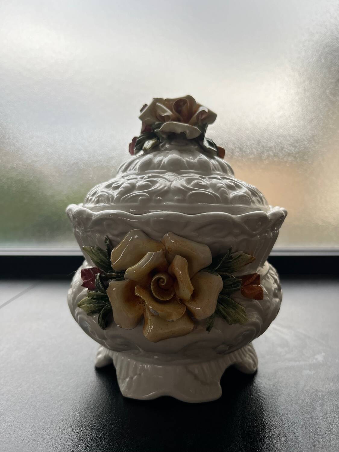 Capodimonte-style porcelain lidded sugar bowl with floral relief