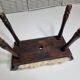 Carved wooden stool covered with Celtic-style sheepskin