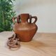 Vase with carved wooden handles