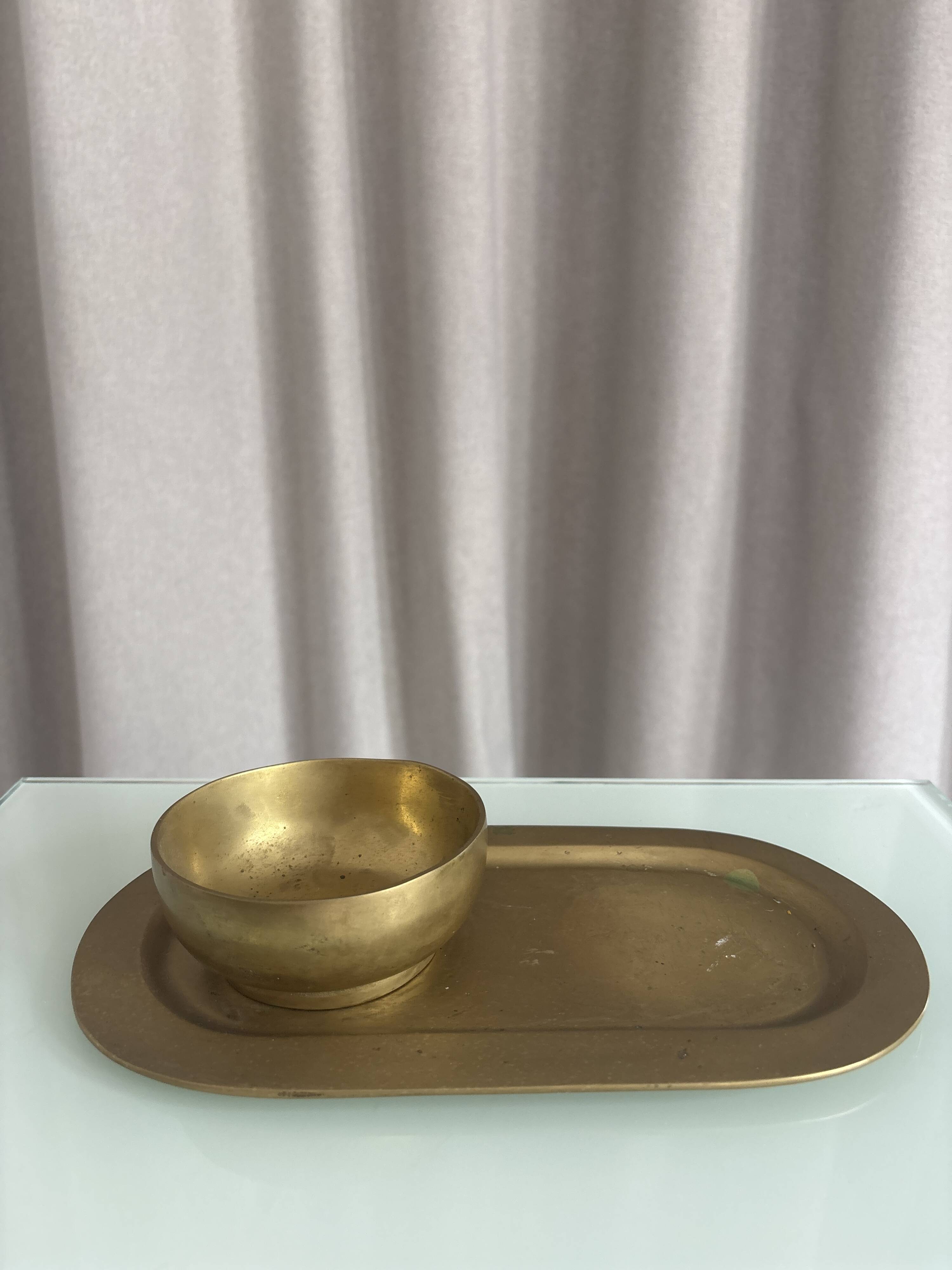 Empty pocket ensemble and bowl in solid brass signed Giò Lanciani.