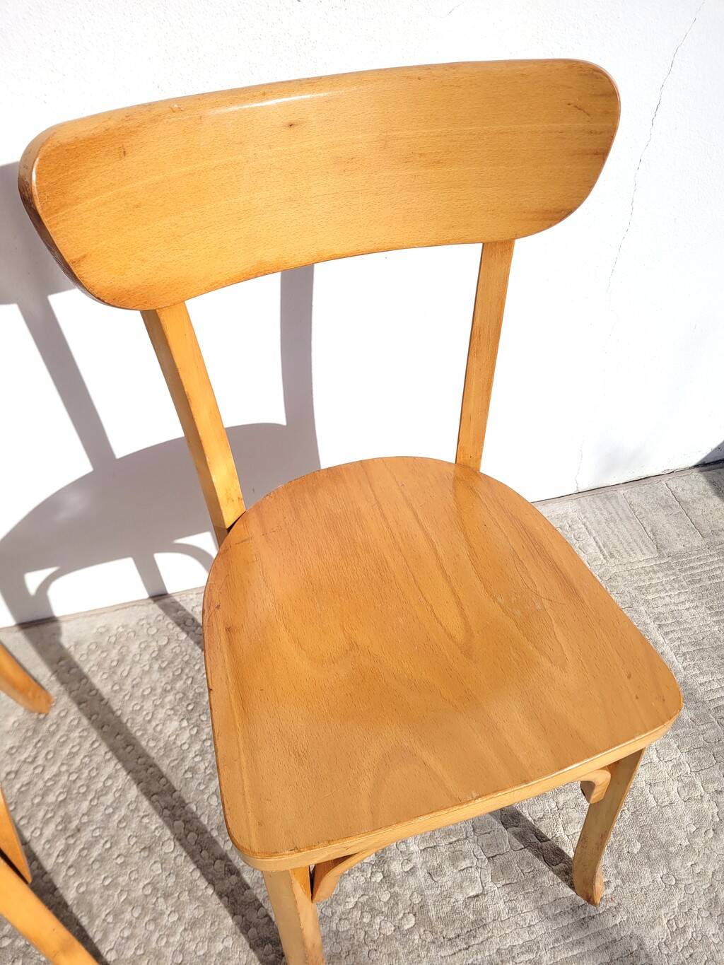 Pair of vintage bistro chairs in golden oak.