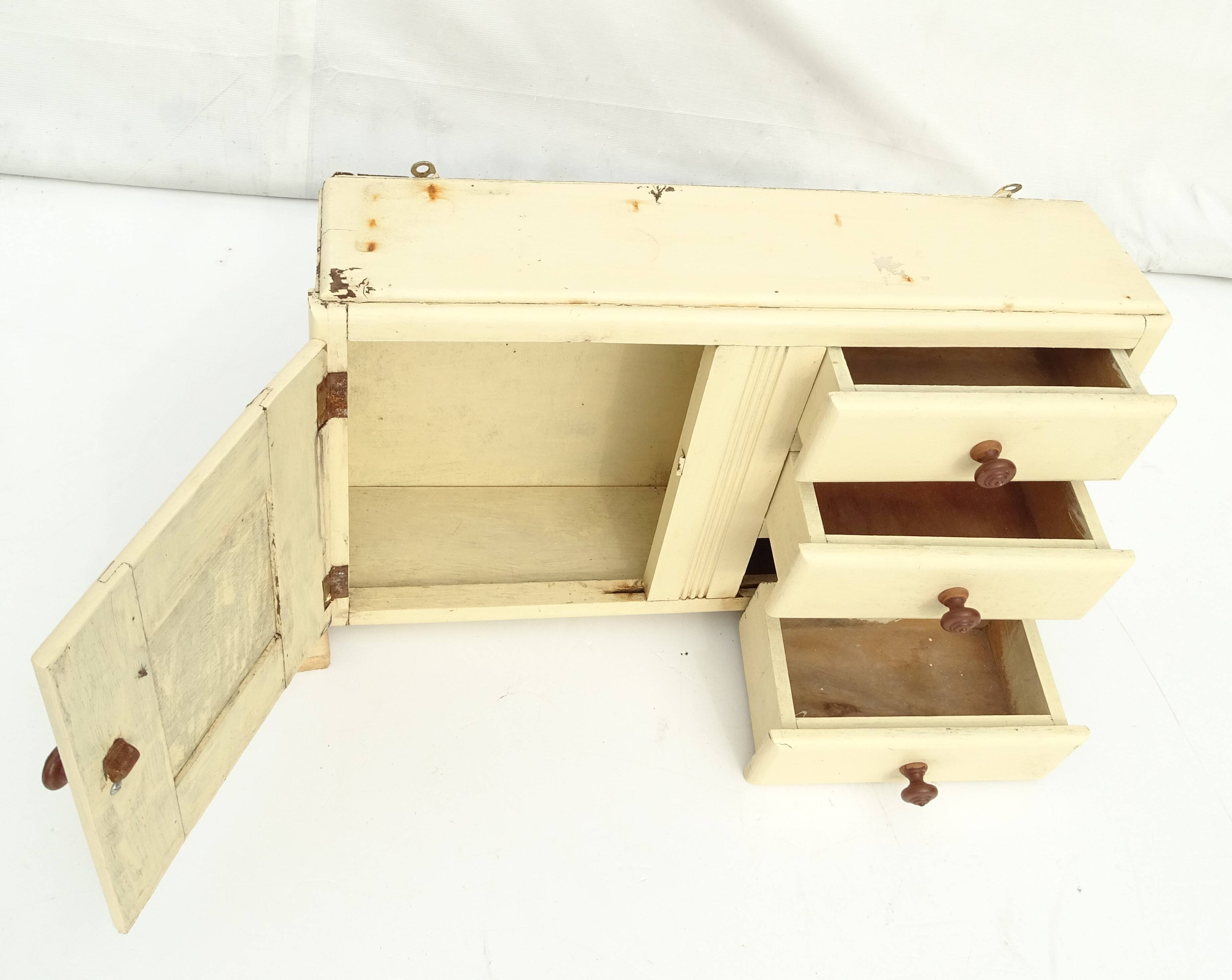 Small vintage wooden wall cupboard.