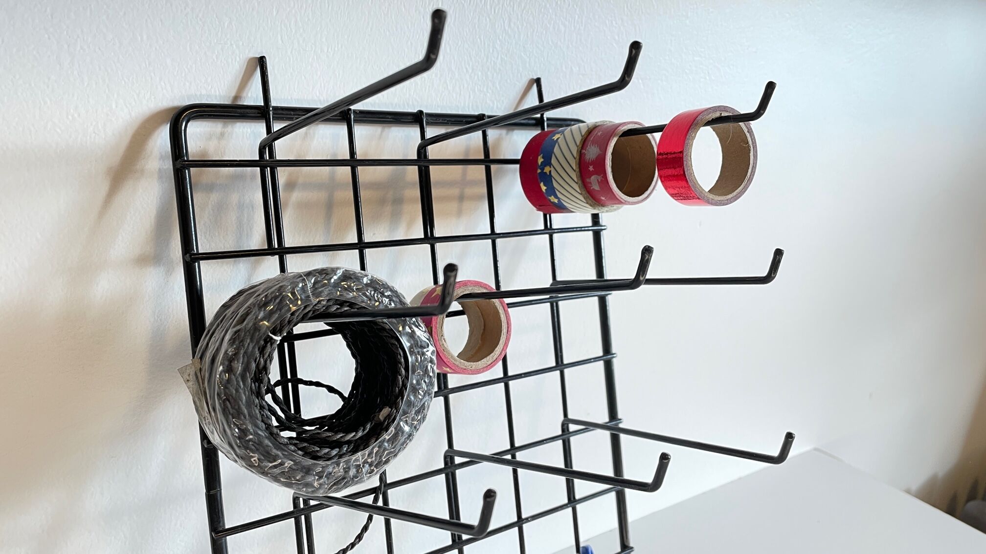 Vintage black metal wall loom display