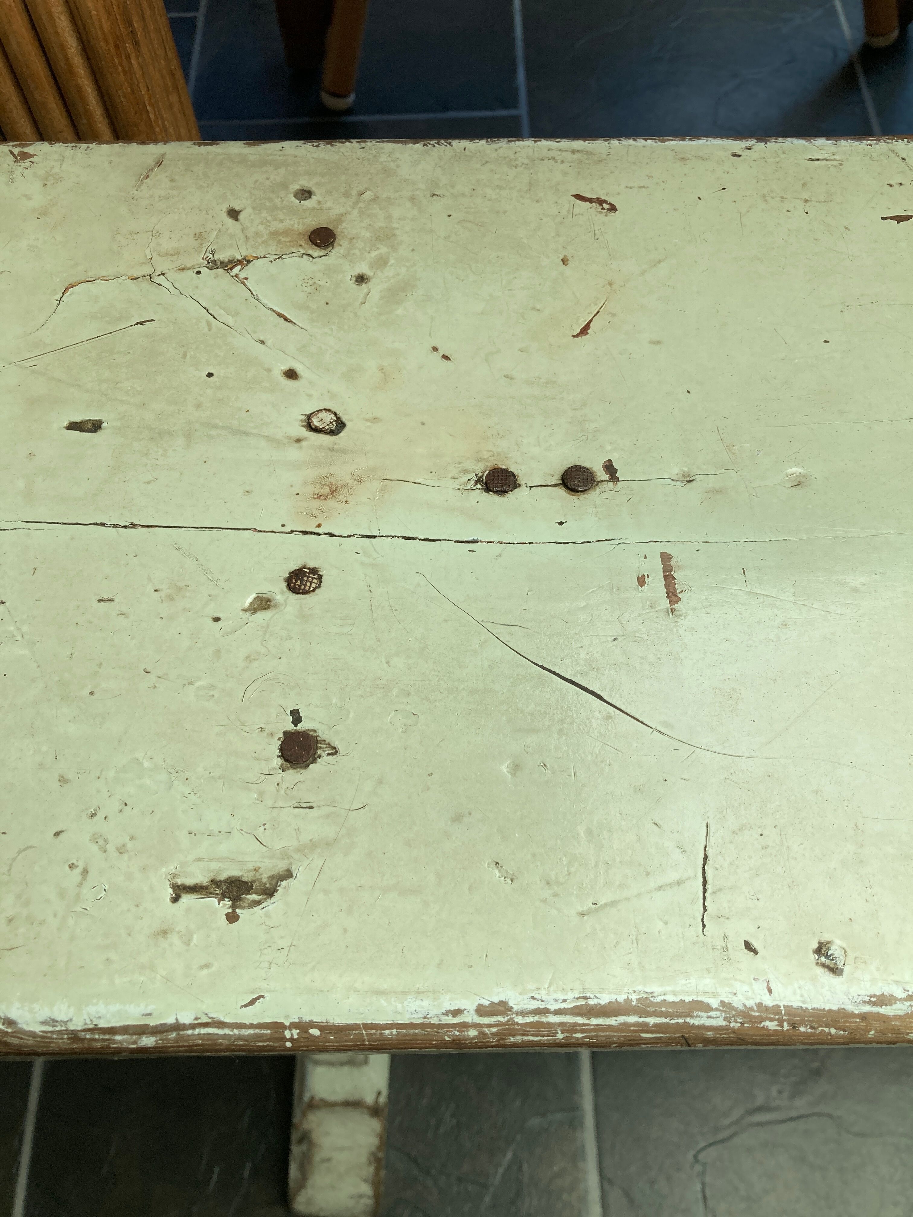 Old wooden bench painted in light green