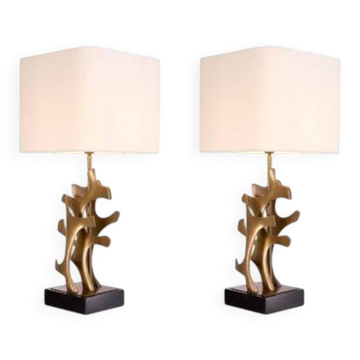 Pair of patinated brass table lamps with black granite base.