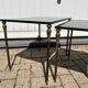 Nested tables in gilded brass in the style of Maison Charles.
