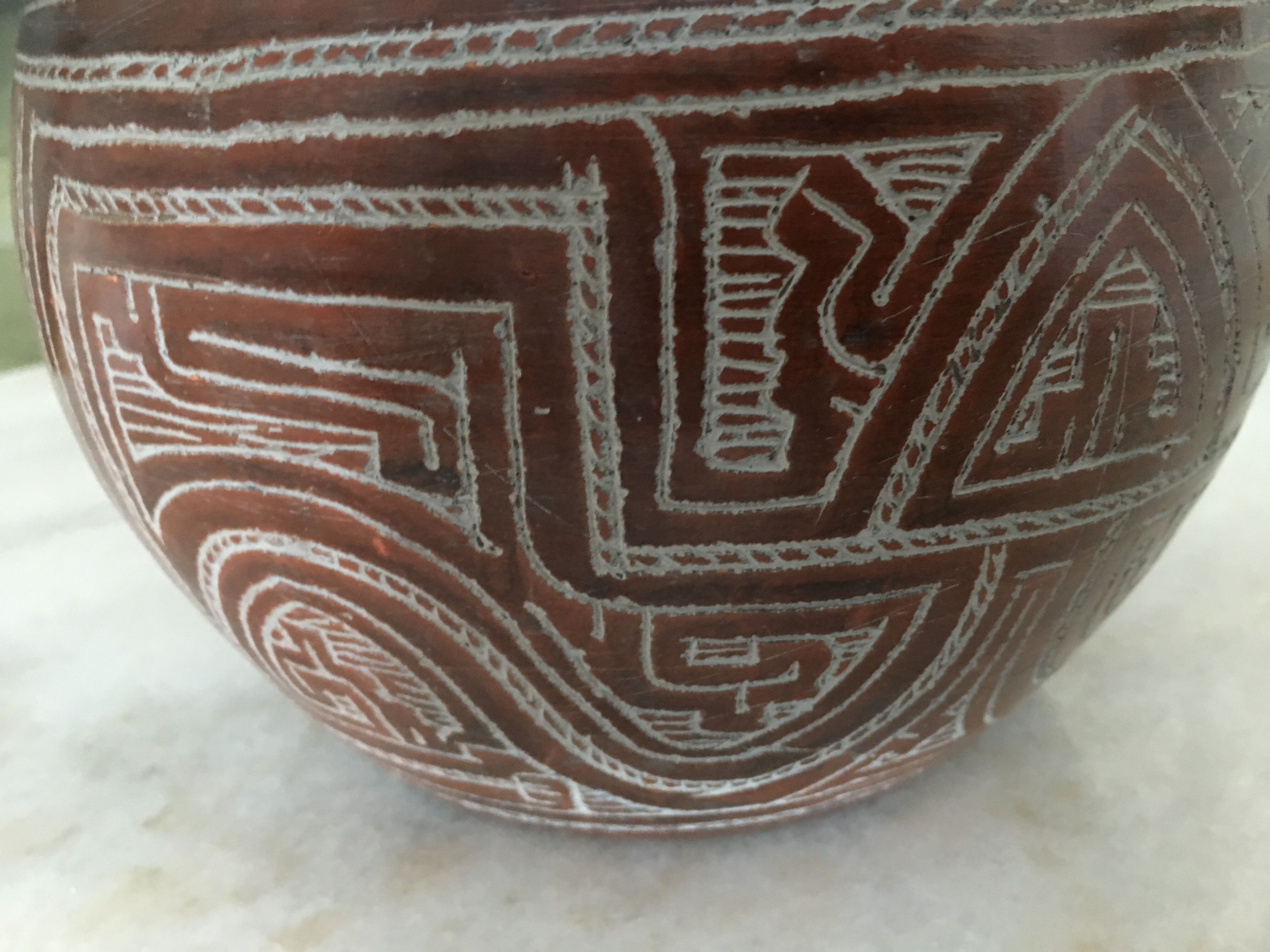 Vase in earth baked ethnic graphic patterns