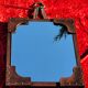 Leather-covered wall mirror attributed to Jacques Adnet 1950