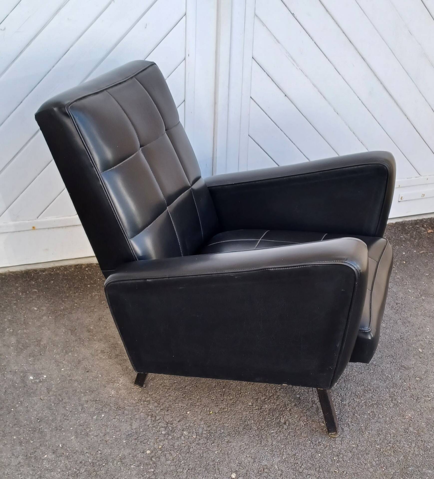 Black faux leather armchair from the 1960s