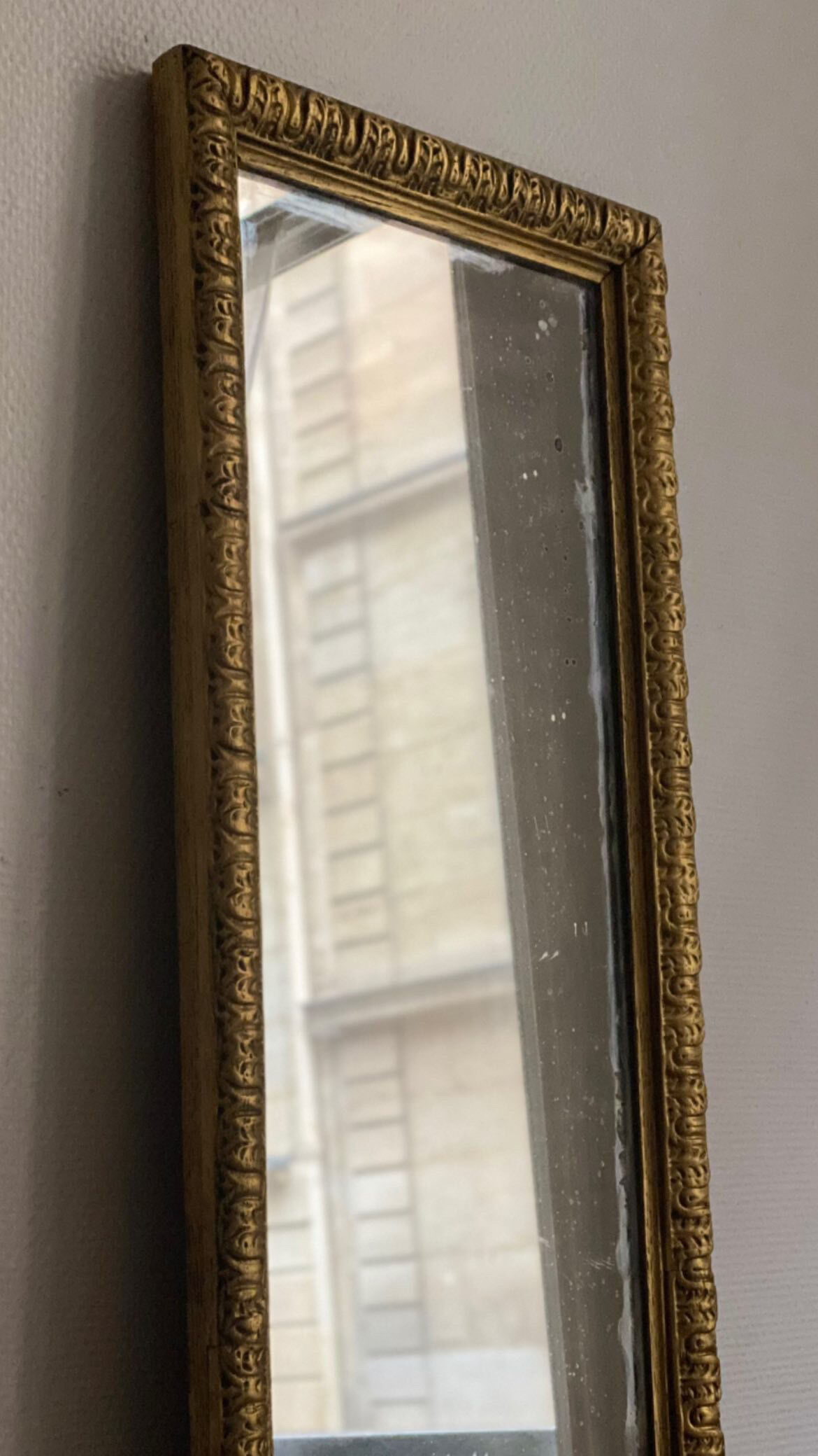 Old rectangular mirror between two golden Louis Philippe