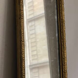 Old rectangular mirror between two golden Louis Philippe