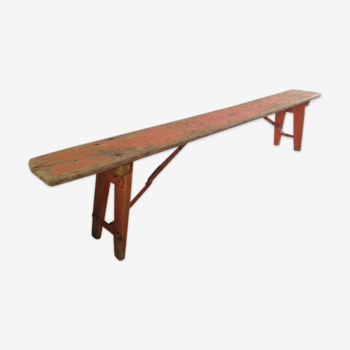 Orange folding wooden bench