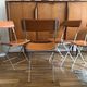 4 folding Sintesi chairs for DWR Lina in metal and vintage camel leather.