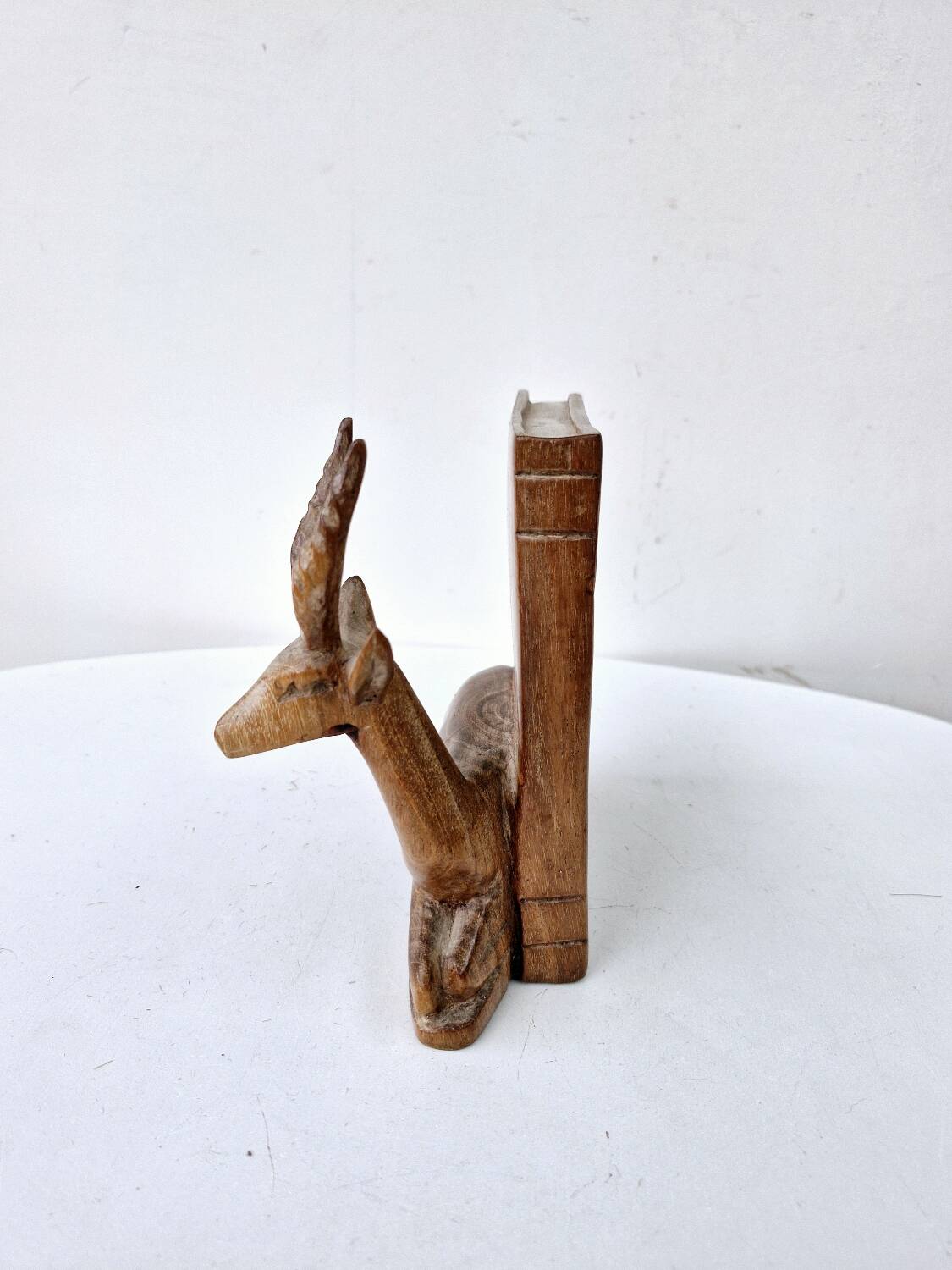 Old antelope bookend in hand carved wood