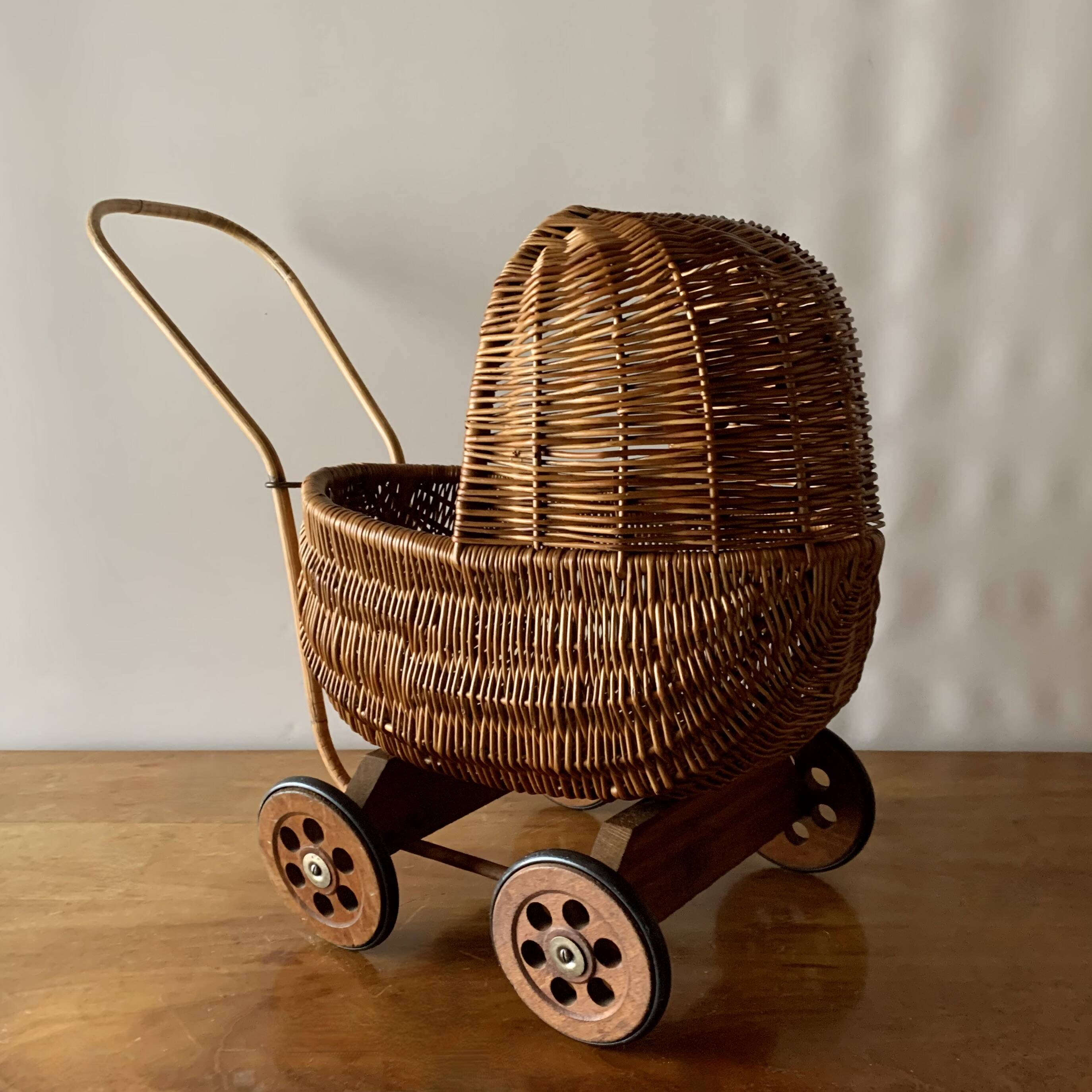 Old wicker dolls' pram - wooden wheels