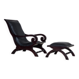 1970s, vintage armchair with footstool, black furniture leather.