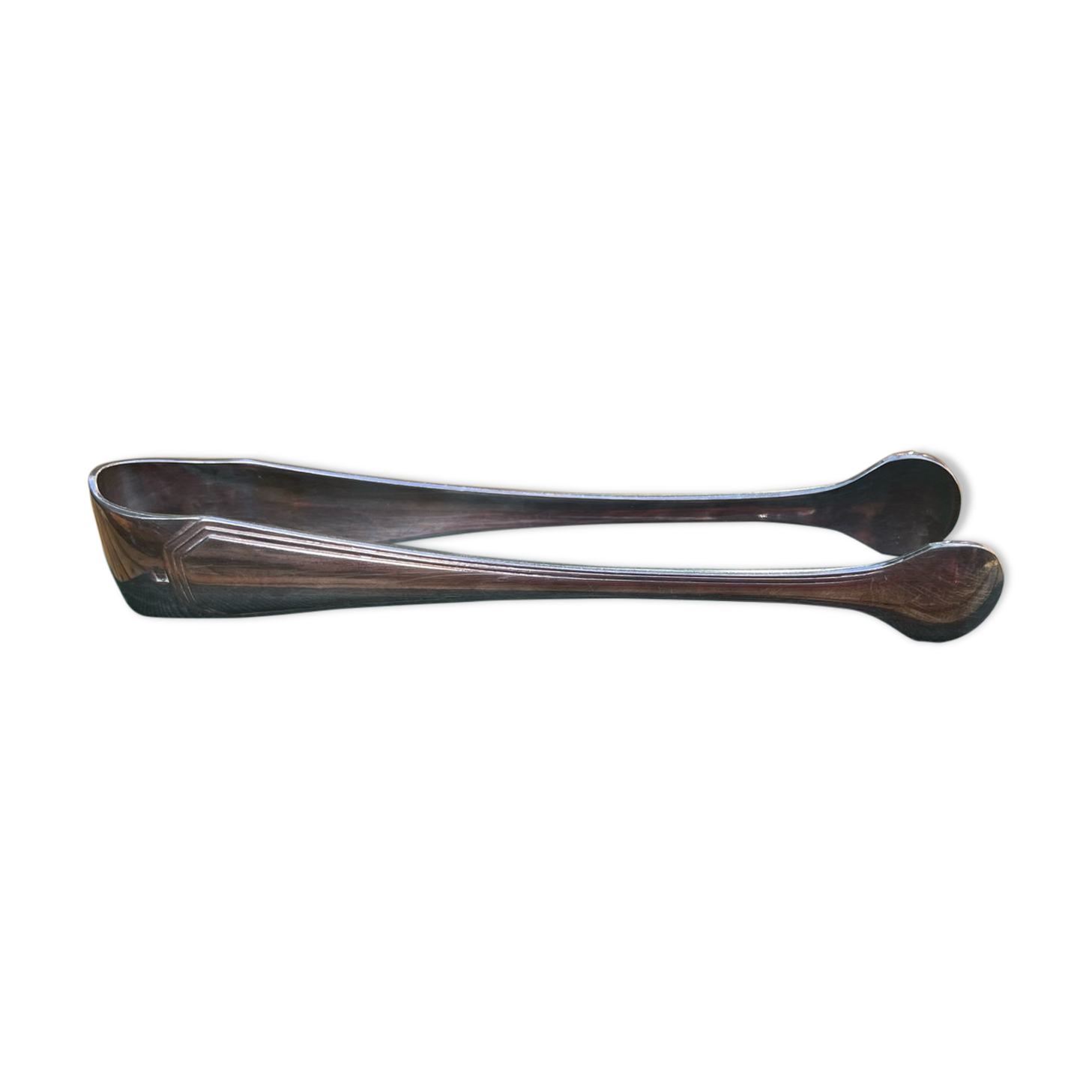 Sugar tongs in silver metal