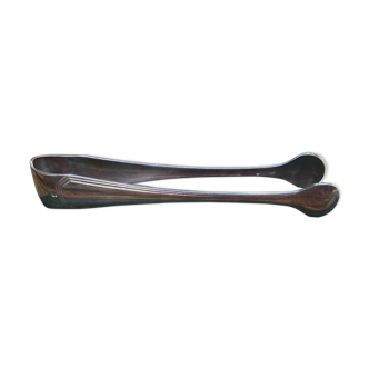 Sugar tongs in silver metal