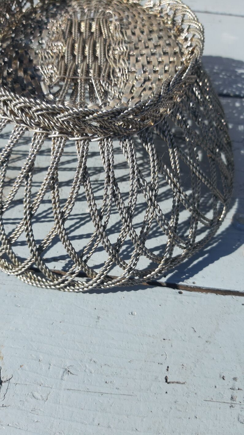 flat basket cut center table in woven metal