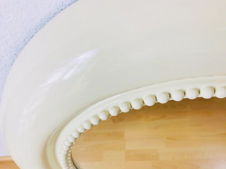 American beige round wall mirror 1970