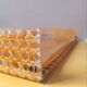 Cane work plateau, lucite and brass 1980