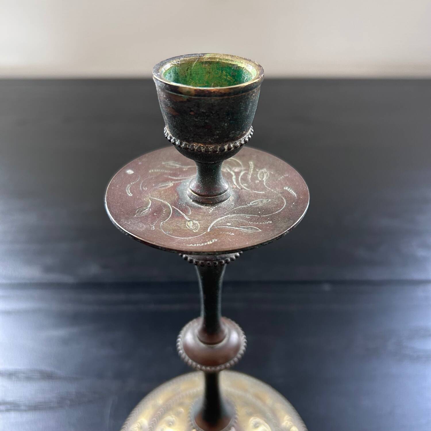 Chiseled brass candlestick