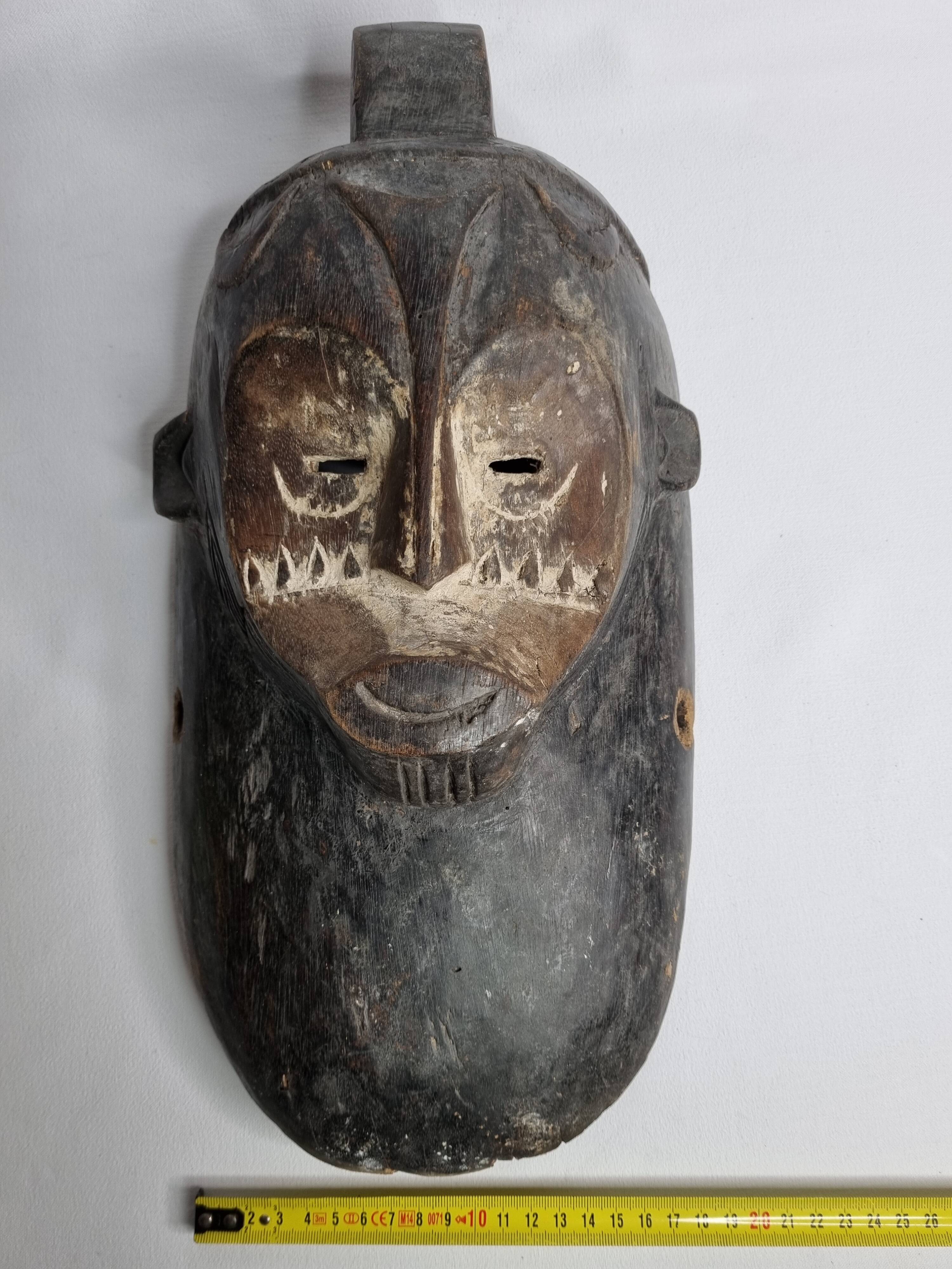 Ancient Fang Ngil tribal mask, traditional African art, Gabon, 20th century, 40 cm