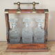 Tantalus - Bottle-carrying liquor cellar with 3 crystal decanters