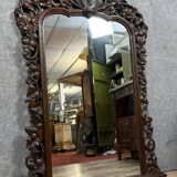 Very important Black Forest mirror in molded and carved wood