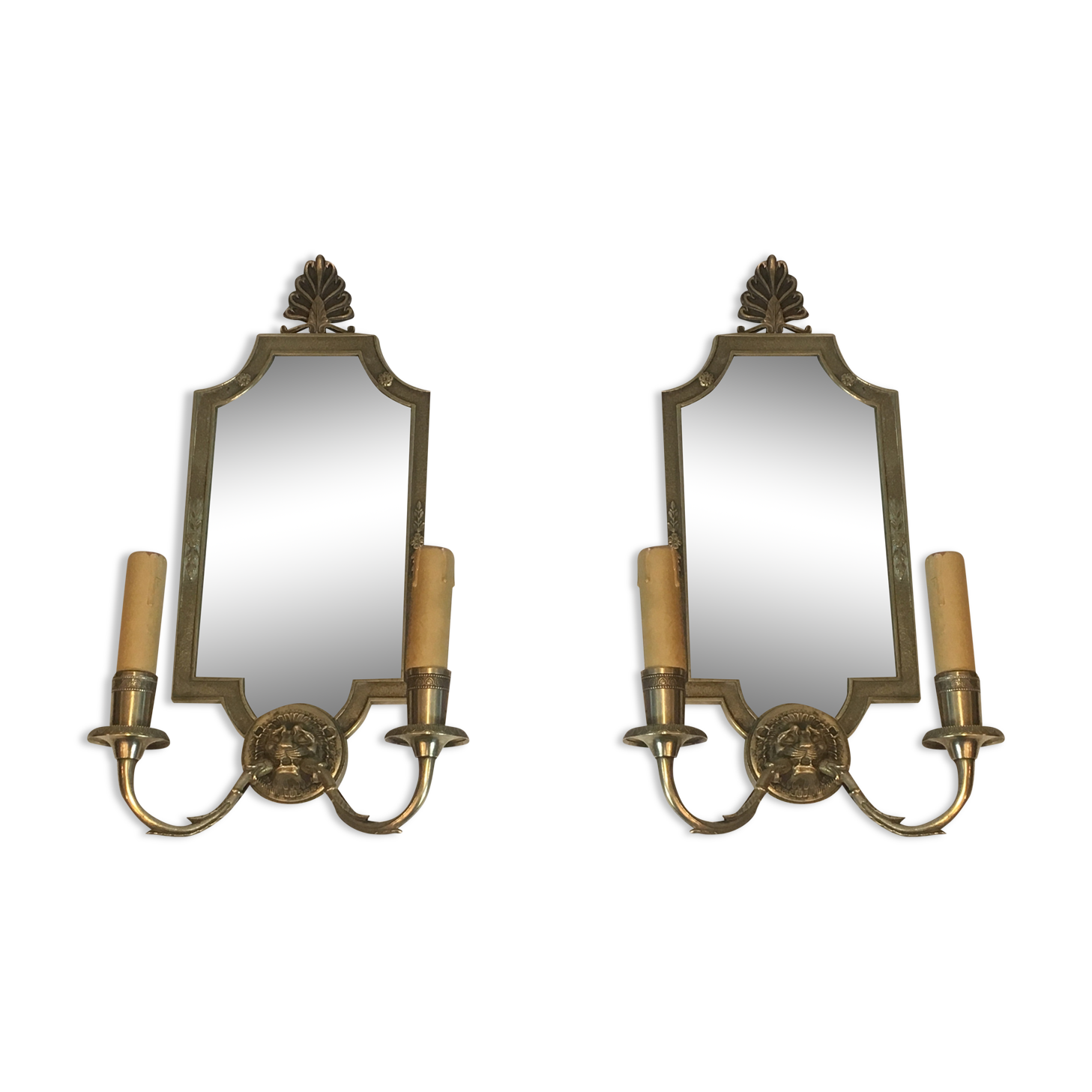 Pair of mirror and bronze wall lamps with lions' heads, french work. around 1940