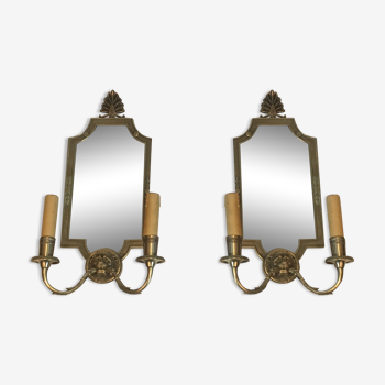 Pair of mirror and bronze wall lamps with lions' heads, french work. around 1940