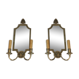 Pair of mirror and bronze wall lamps with lions' heads, french work. around 1940