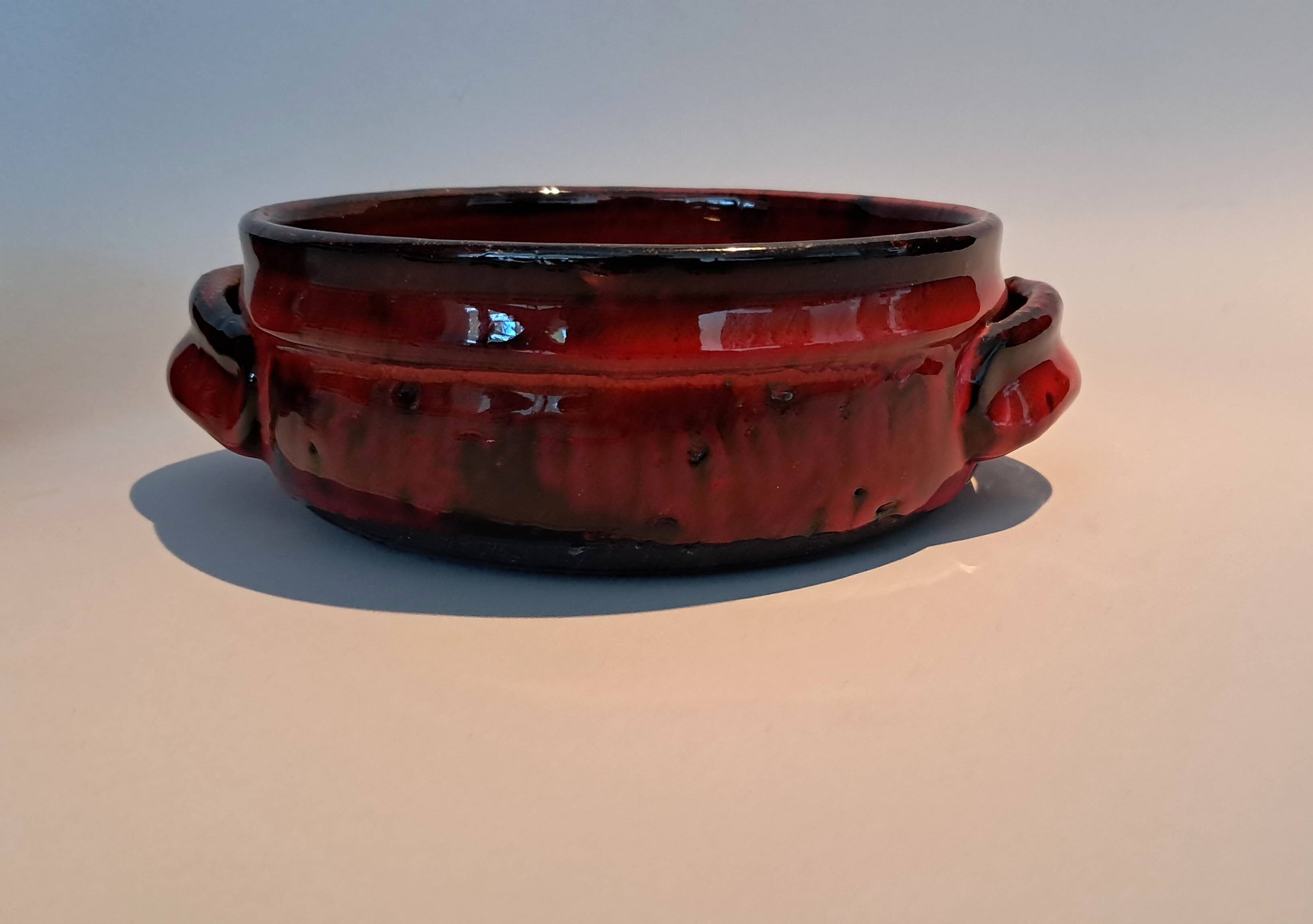 Red ceramic pieces by Gérard Hoffman (1917/1965).