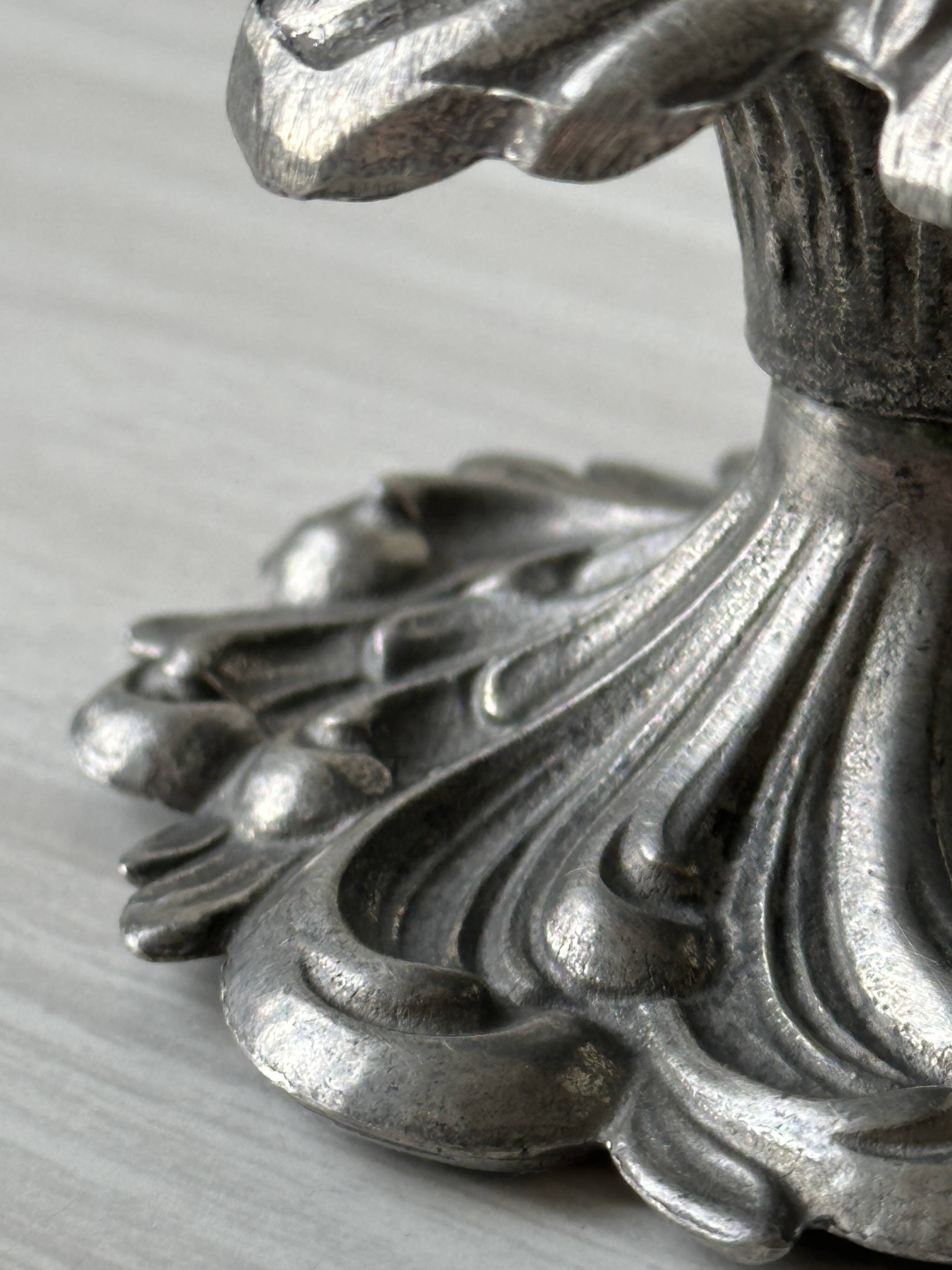 Metal candle holder.