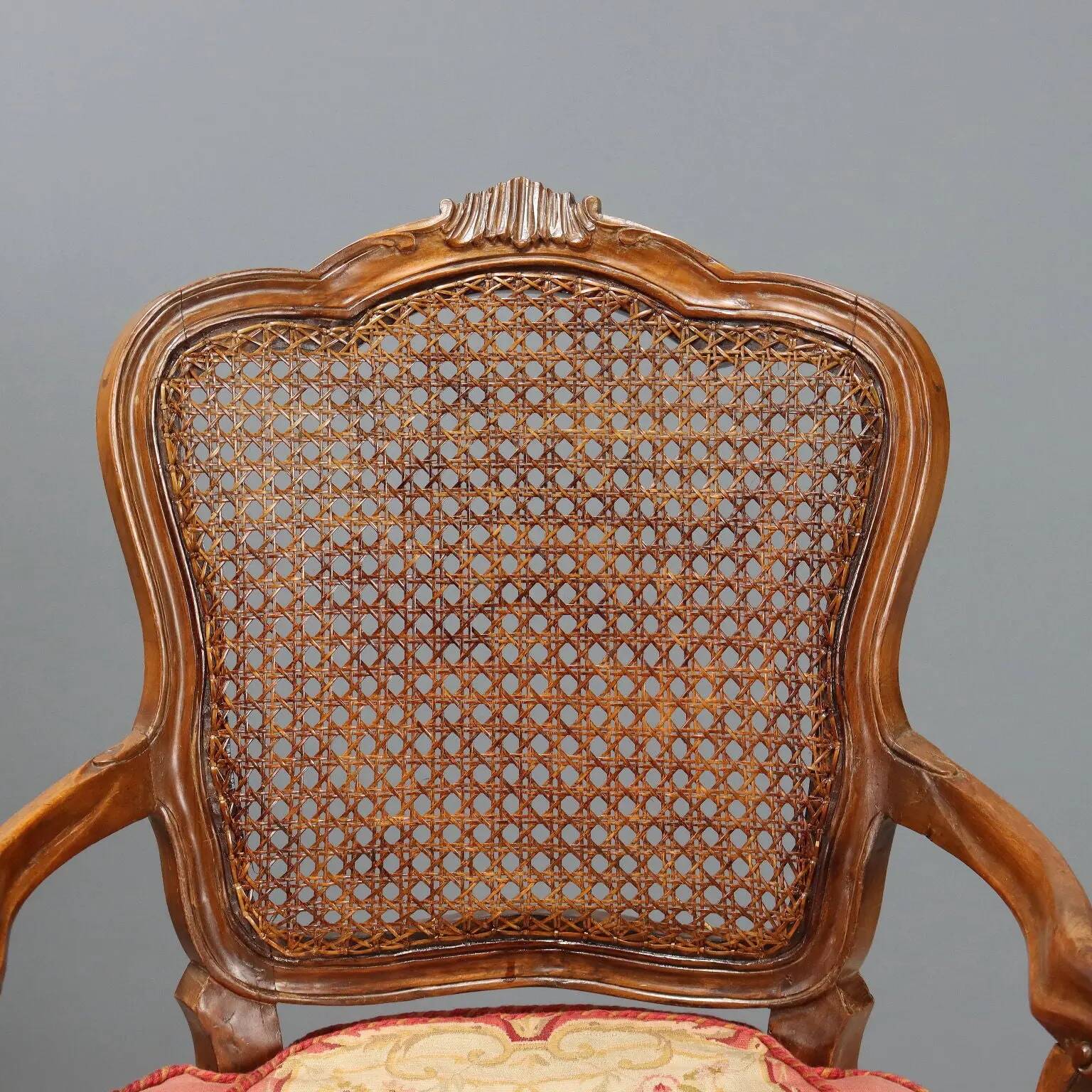 Antique baroque-style armchairs in walnut and fabric, 19th century.