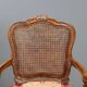 Antique baroque-style armchairs in walnut and fabric, 19th century.