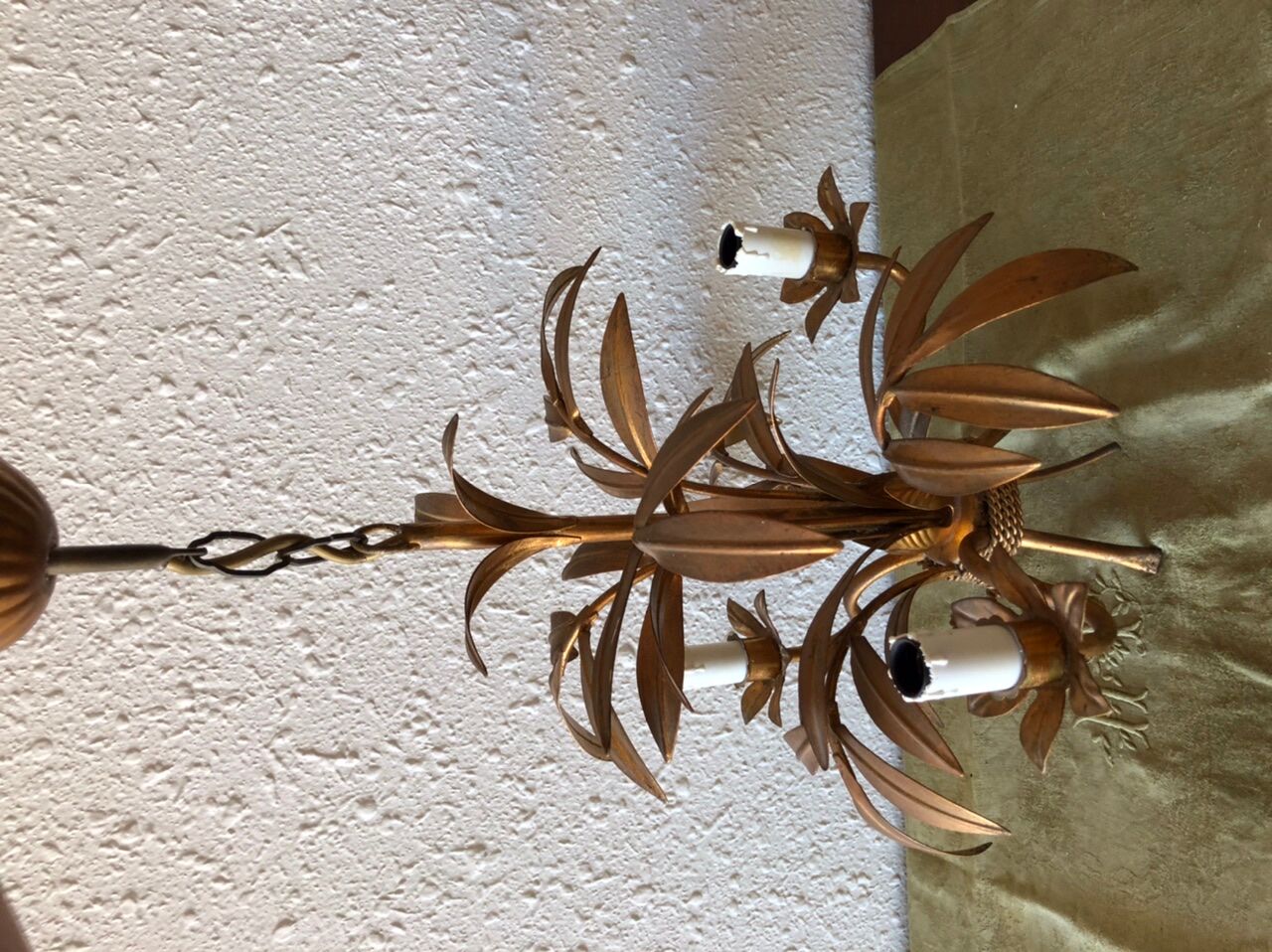 Golden vintage chandelier with leaf decoration