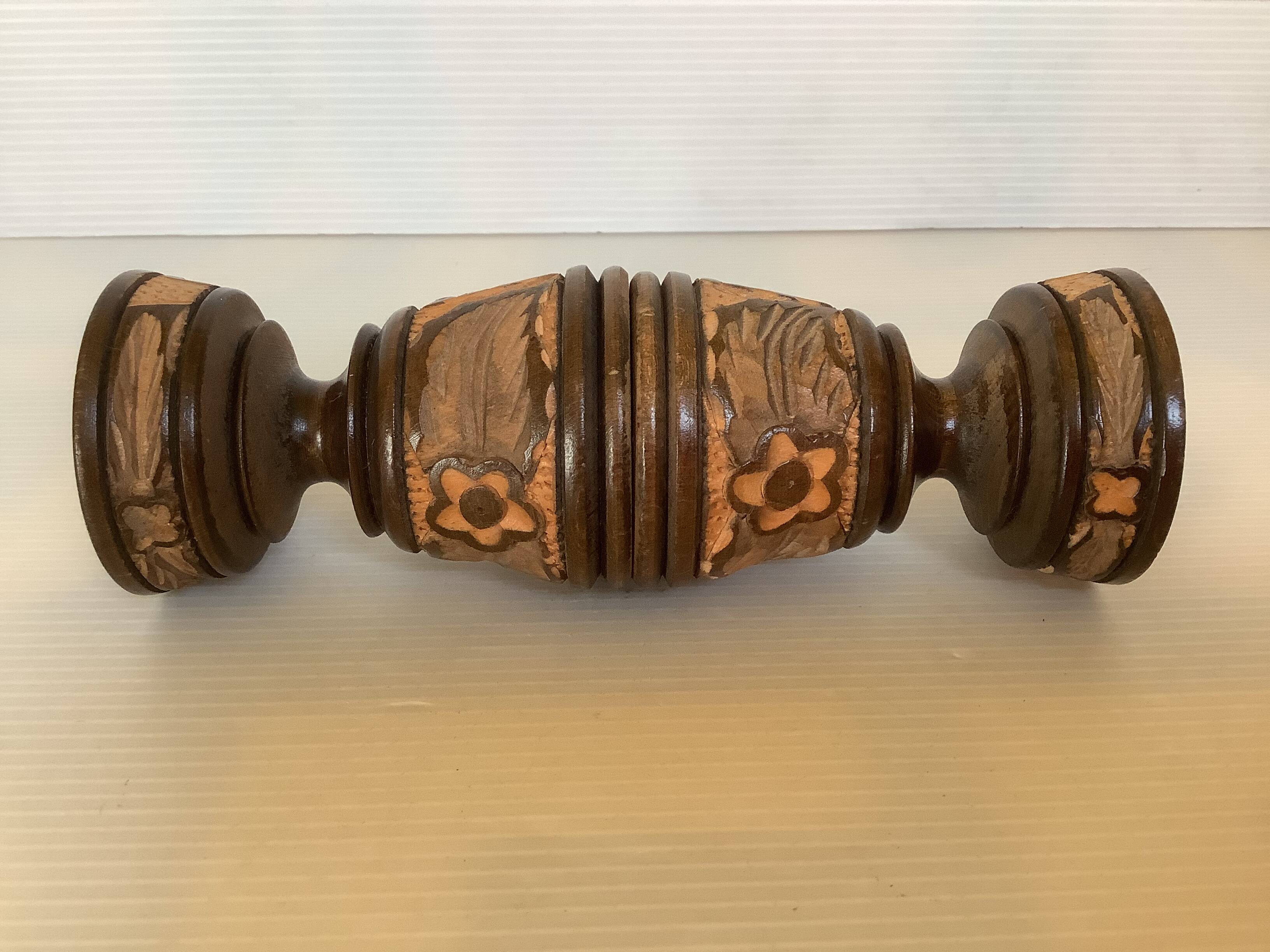 Pair of carved wooden candlesticks