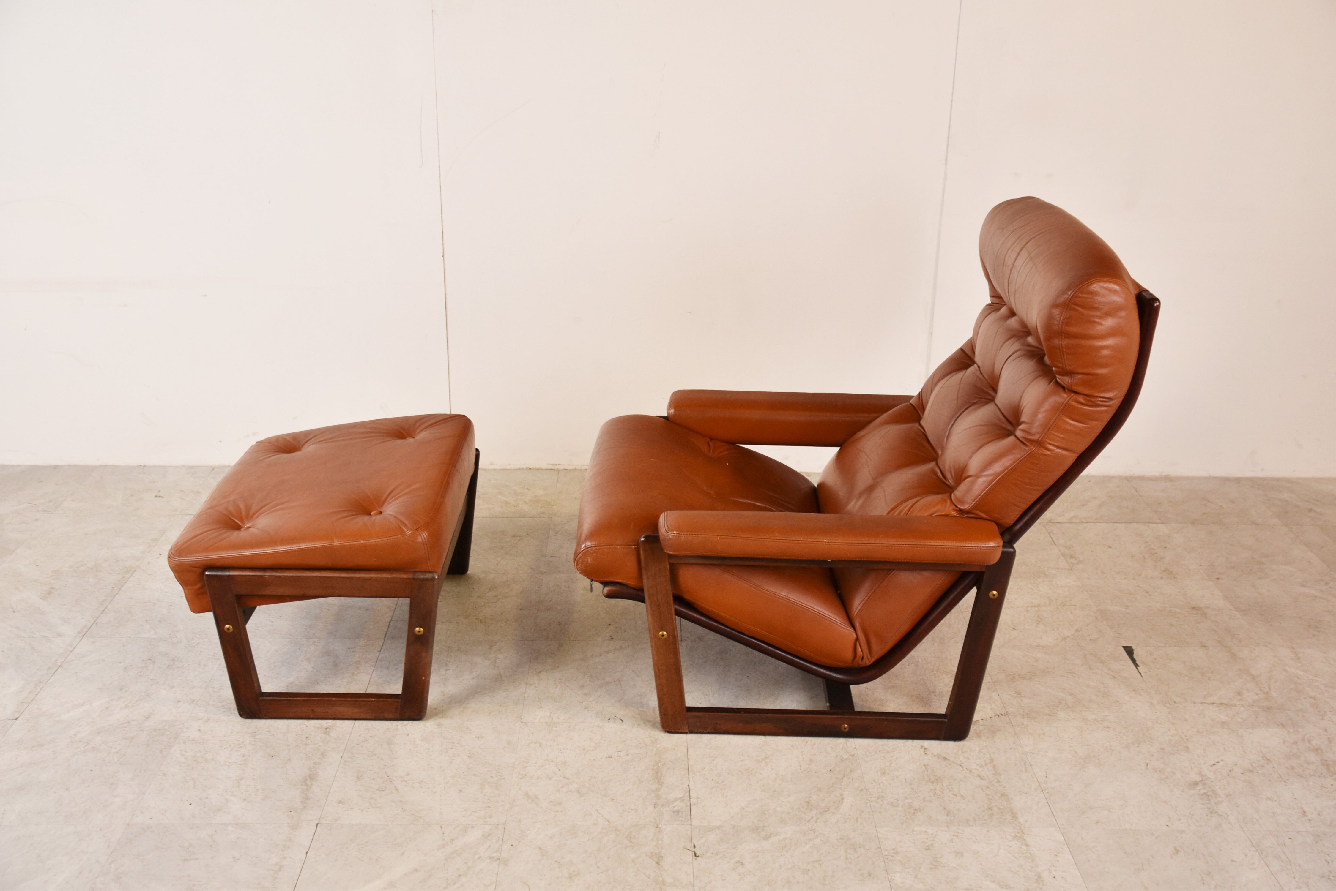 Vintage leather armchair with hocker, 1970s