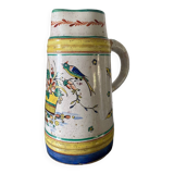 Old ceramic pitcher (18th century?) decorated with polychrome exotic birds