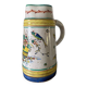Old ceramic pitcher (18th century?) decorated with polychrome exotic birds