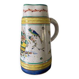 Old ceramic pitcher (18th century?) decorated with polychrome exotic birds