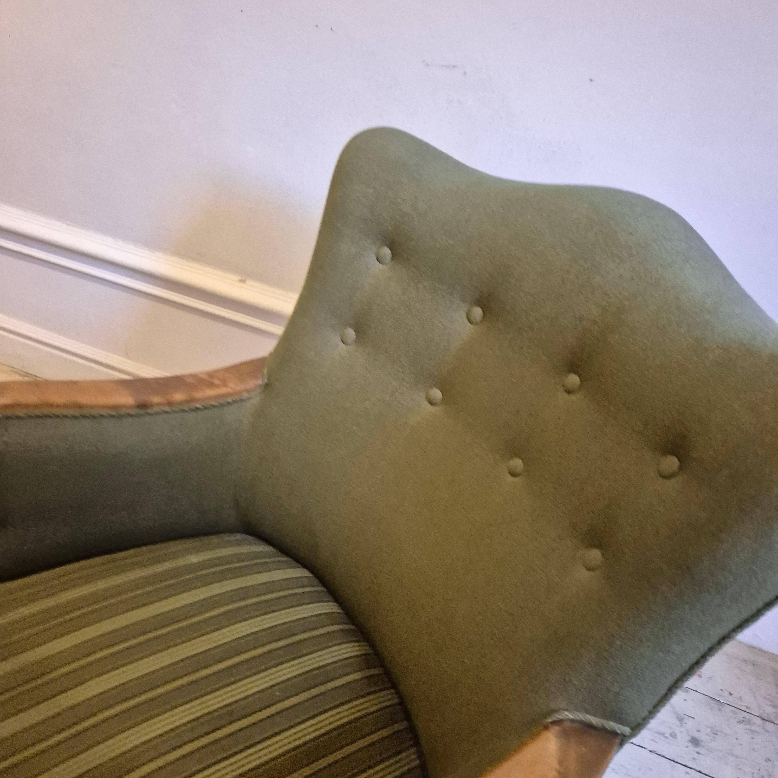 Modern Danish armchairs by Alfred Christensen. Beautiful shape, brass legs.