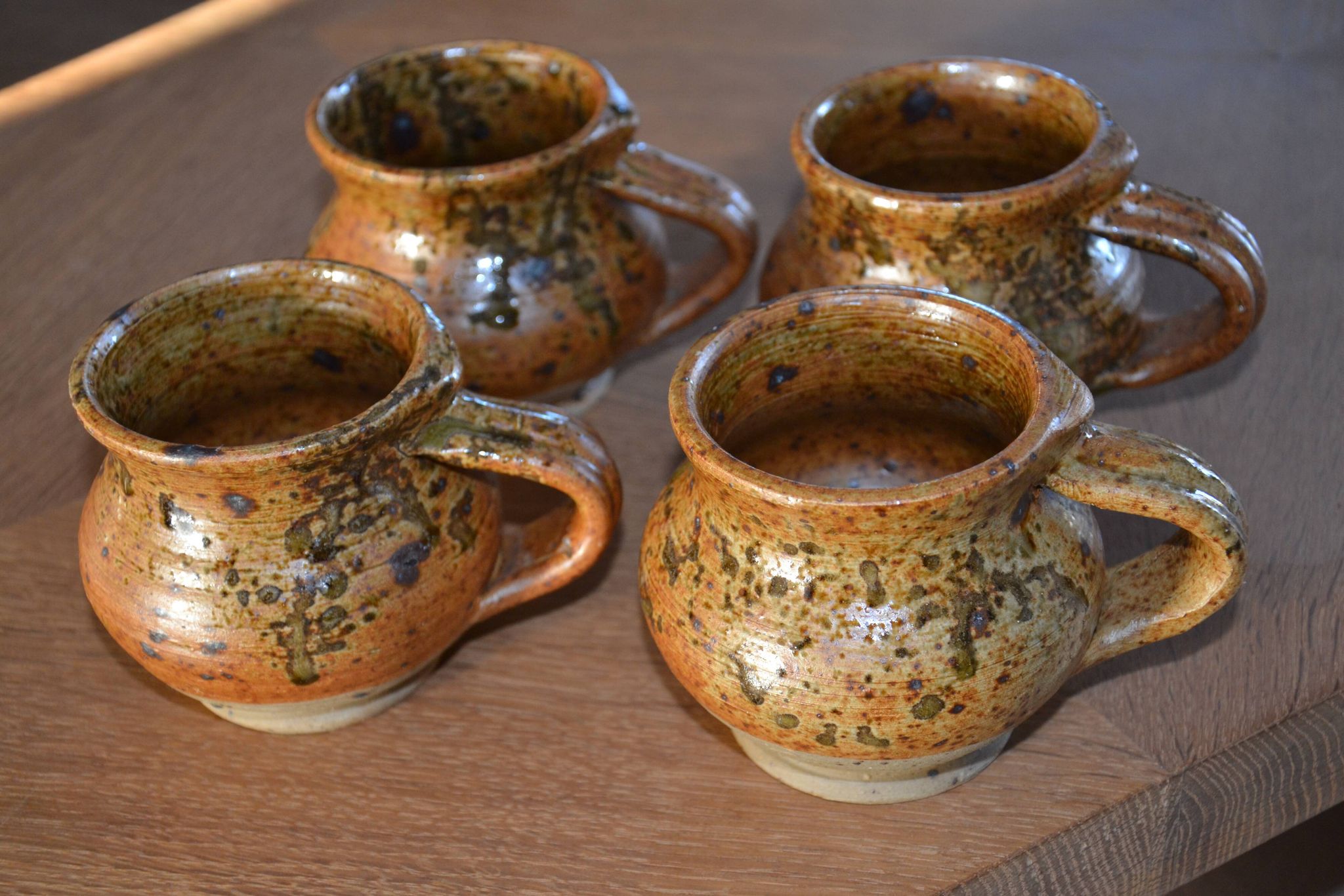 4 pyrite stoneware cups/mugs/coffee cups signed J.P.G.