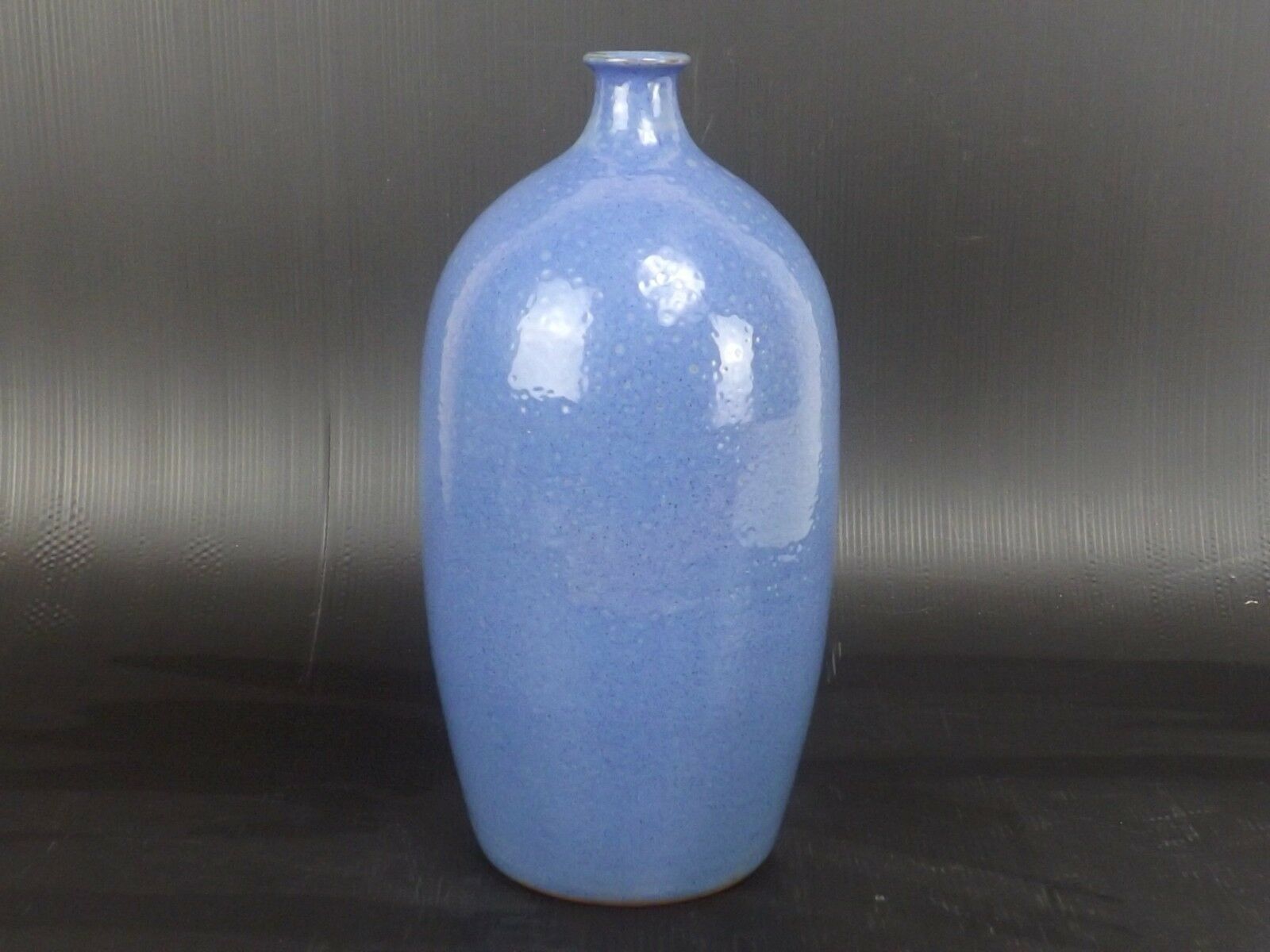 Signed enamelled terracotta bottle vase